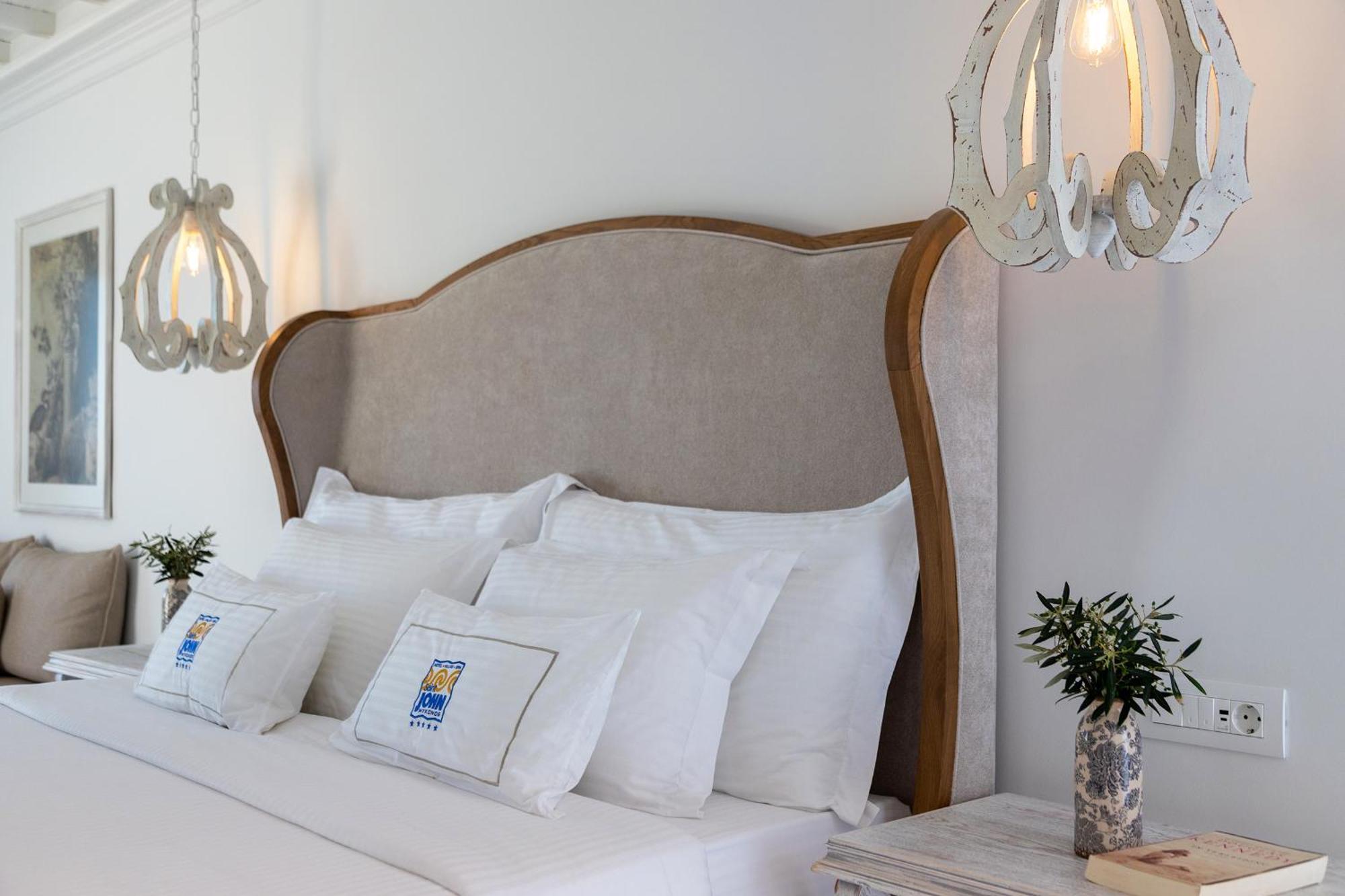 Saint John Hotel Villas & Spa Agios Ioannis Diakoftis Eksteriør bilde A bed with a headboard